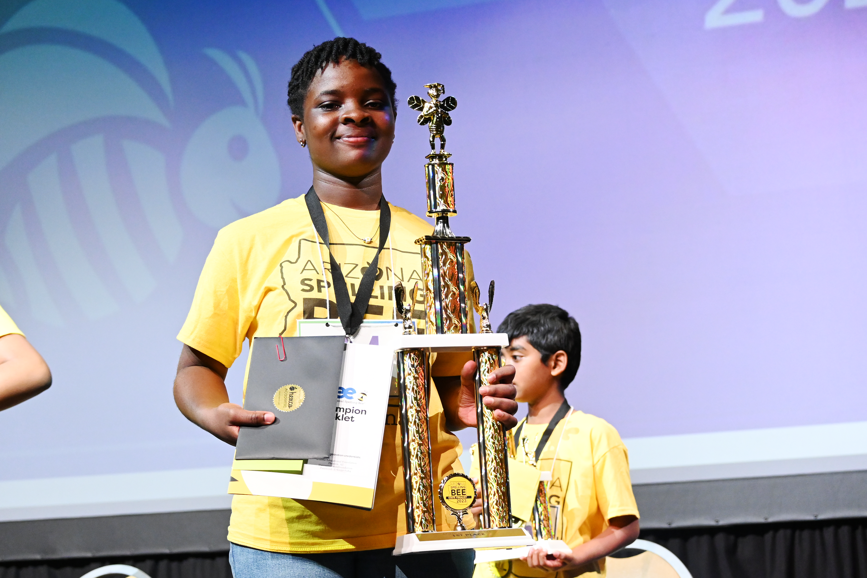 Female Student Holding Trophy