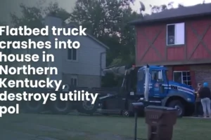 Flatbed truck crashes into house in Northern Kentucky, destroys utility pol